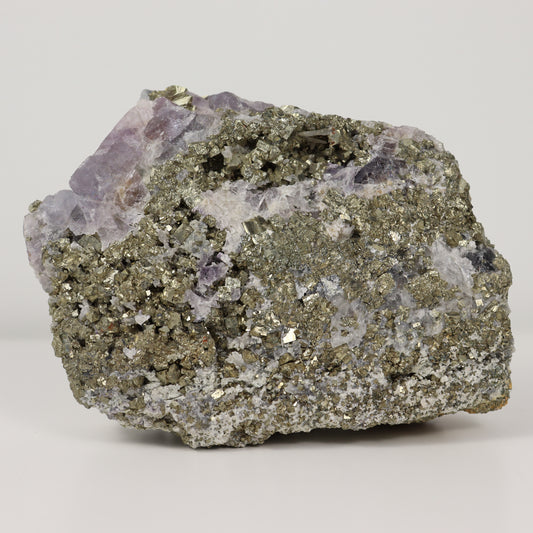 Pyrite Specimen with Clear Quartz and Amethyst Inclusions